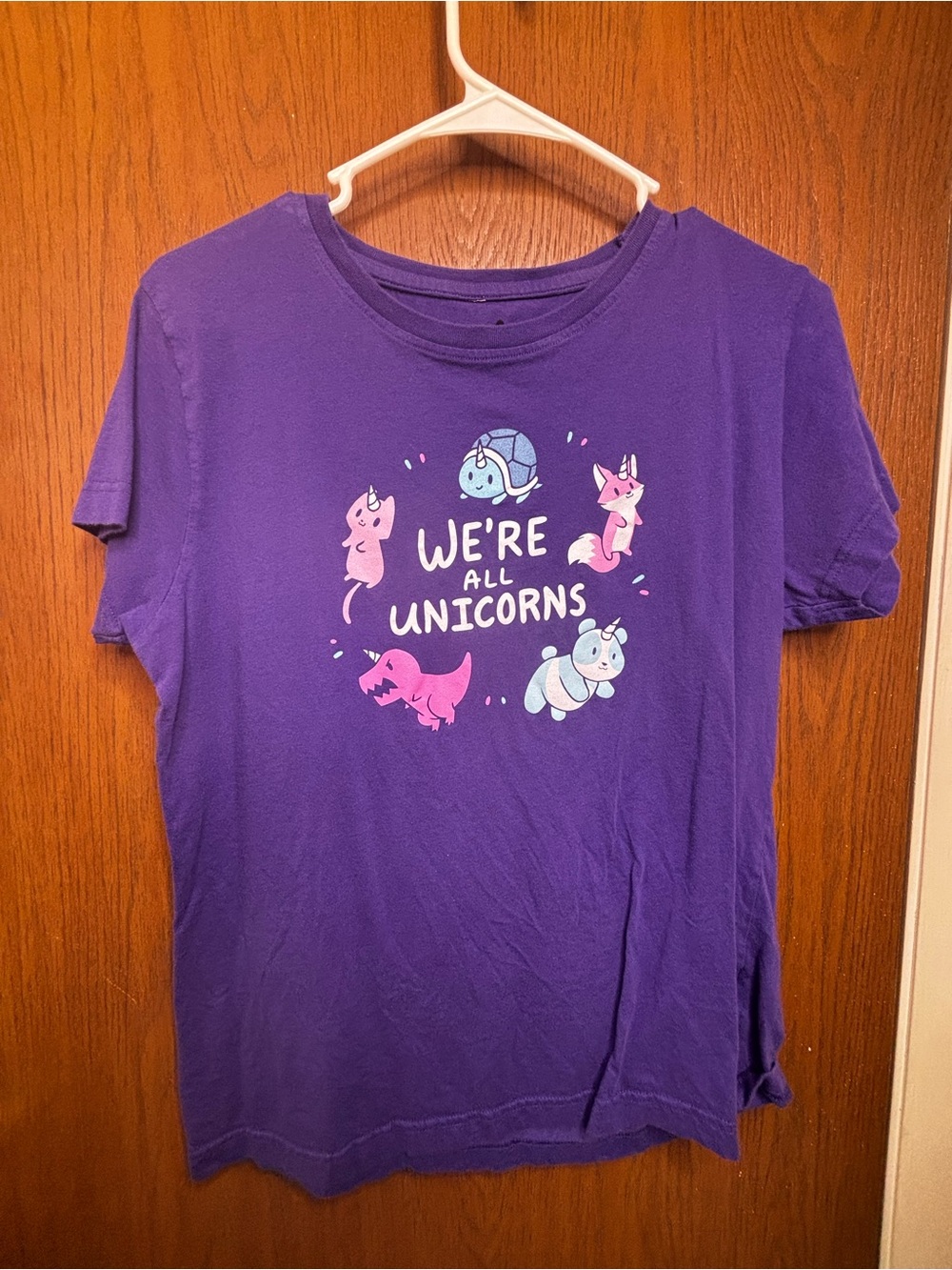 Purple 'We're All Unicorns' Graphic Tee